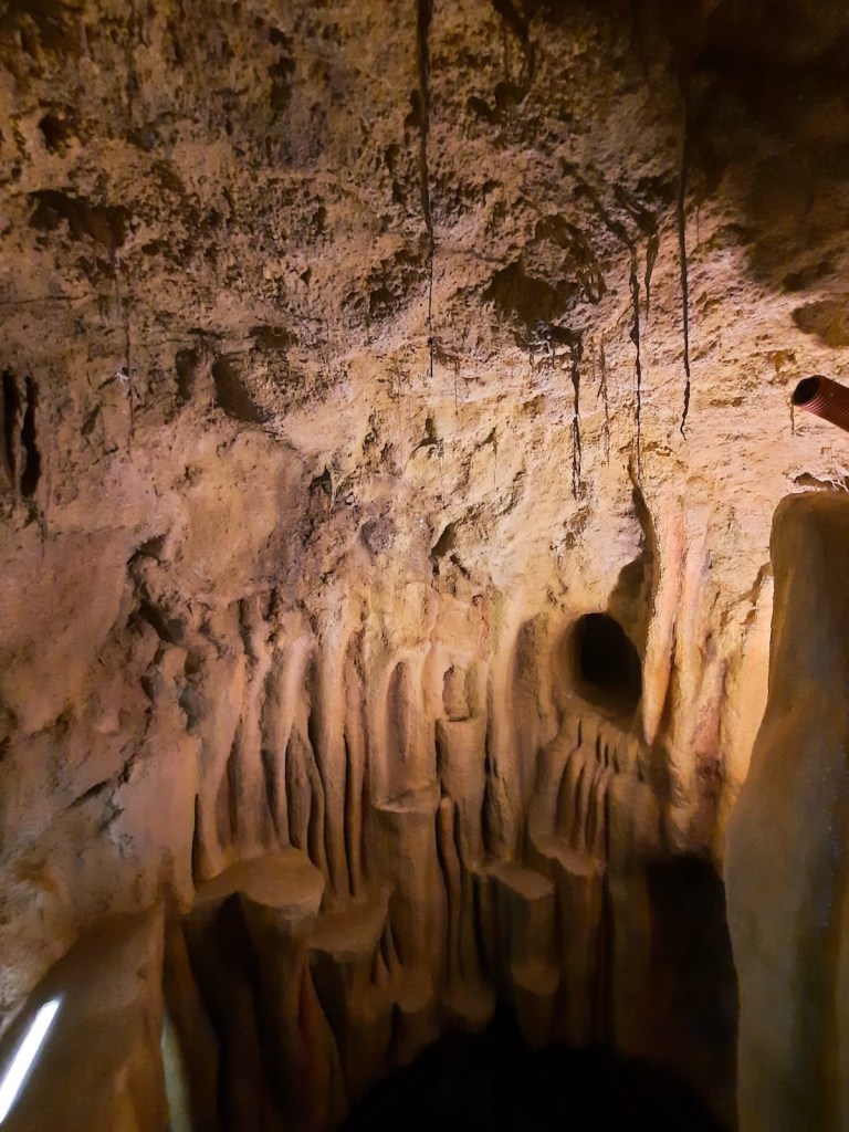 A detailed cavern with a variety of platforms in the stone.