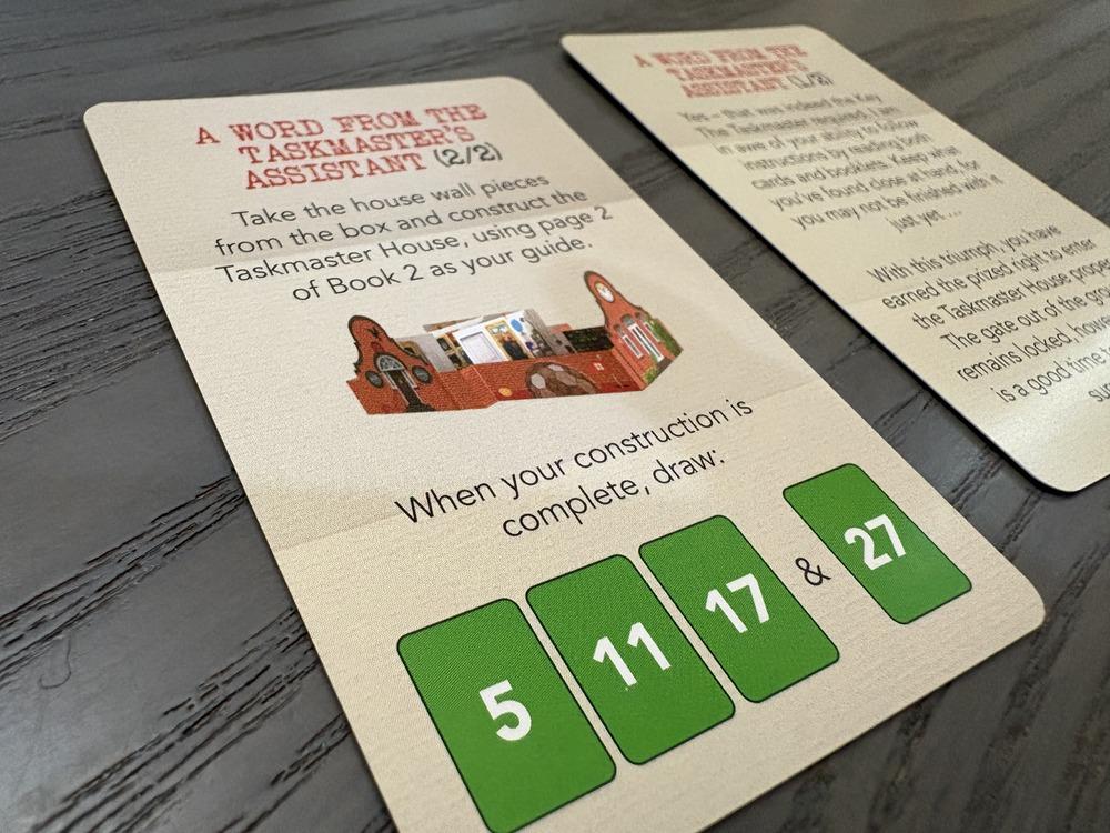 A close up on cards for the Taskmaster game that give the player instructions.