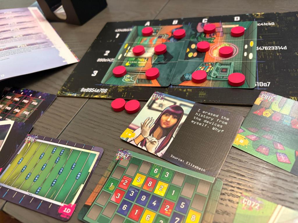 A grid of cards with red wooden discs sits on a grey table. Other cards feature a bird's eye view of a foosball table and a multicolored grid.