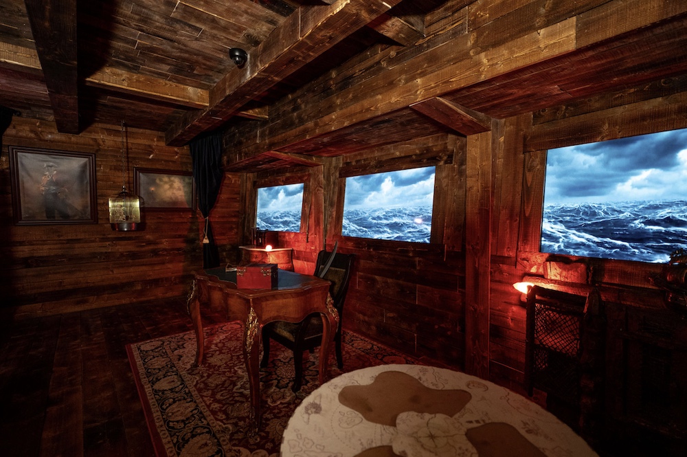 The captain's quarters inside of an old ship.