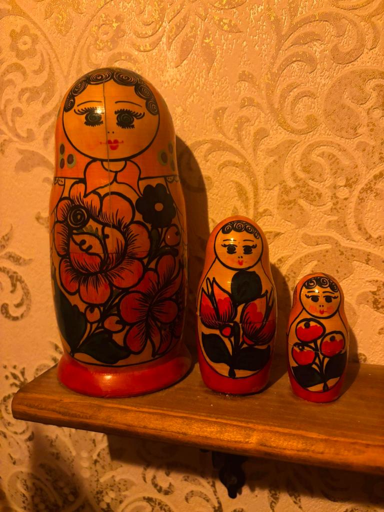 A set of Russian nesting dolls on a shelf