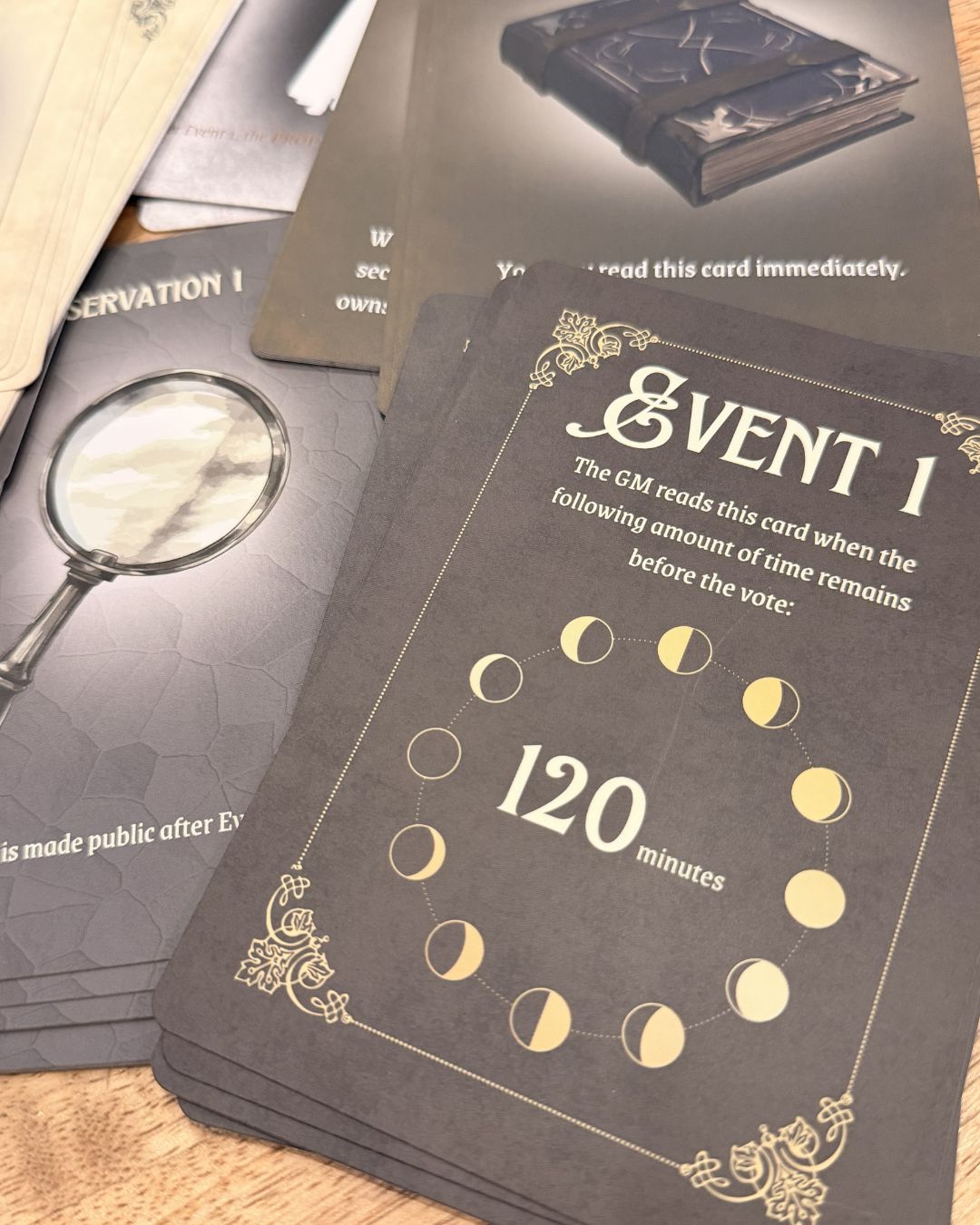 Close up of card titled "Event 1 with phases of moon