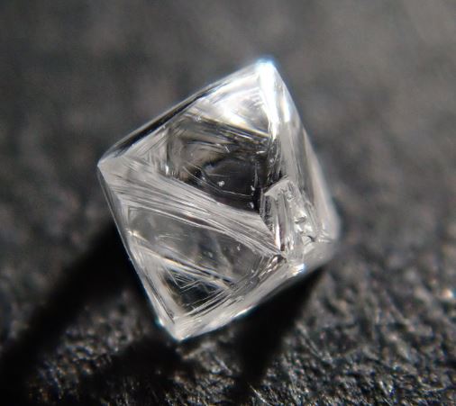 uncut diamond gem in a kite shape