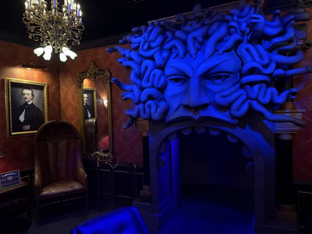 The principal's office with a massive medusa fireplace.