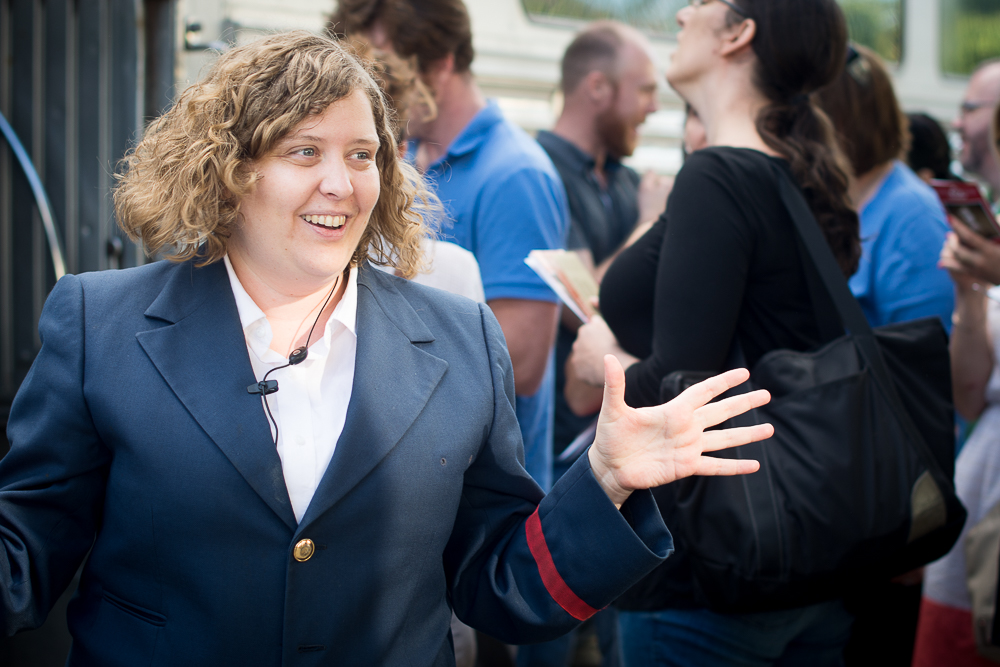 woman with curly blond hair in blazer